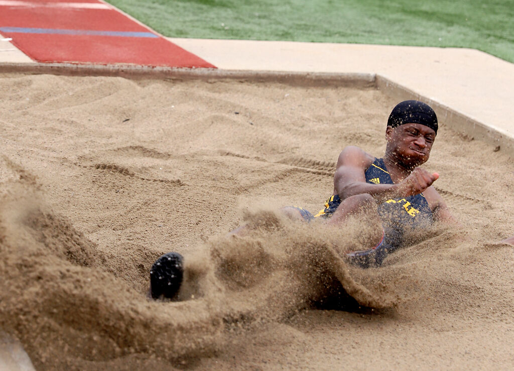 Battle High School junior Jamal Jones lands